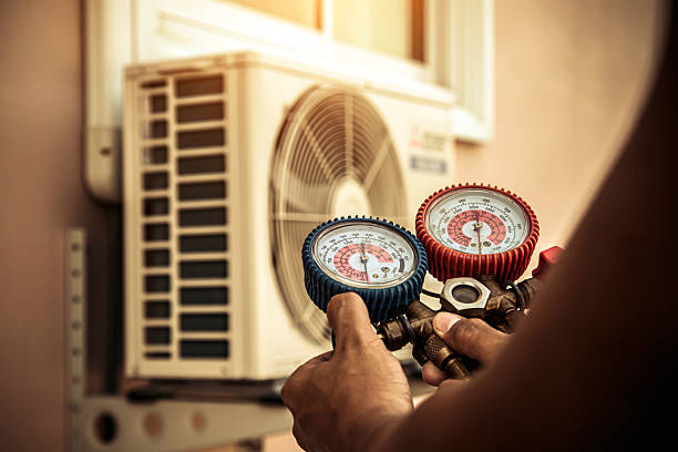 Professional Air Conditioning Service technician working in Hutchinson, PA